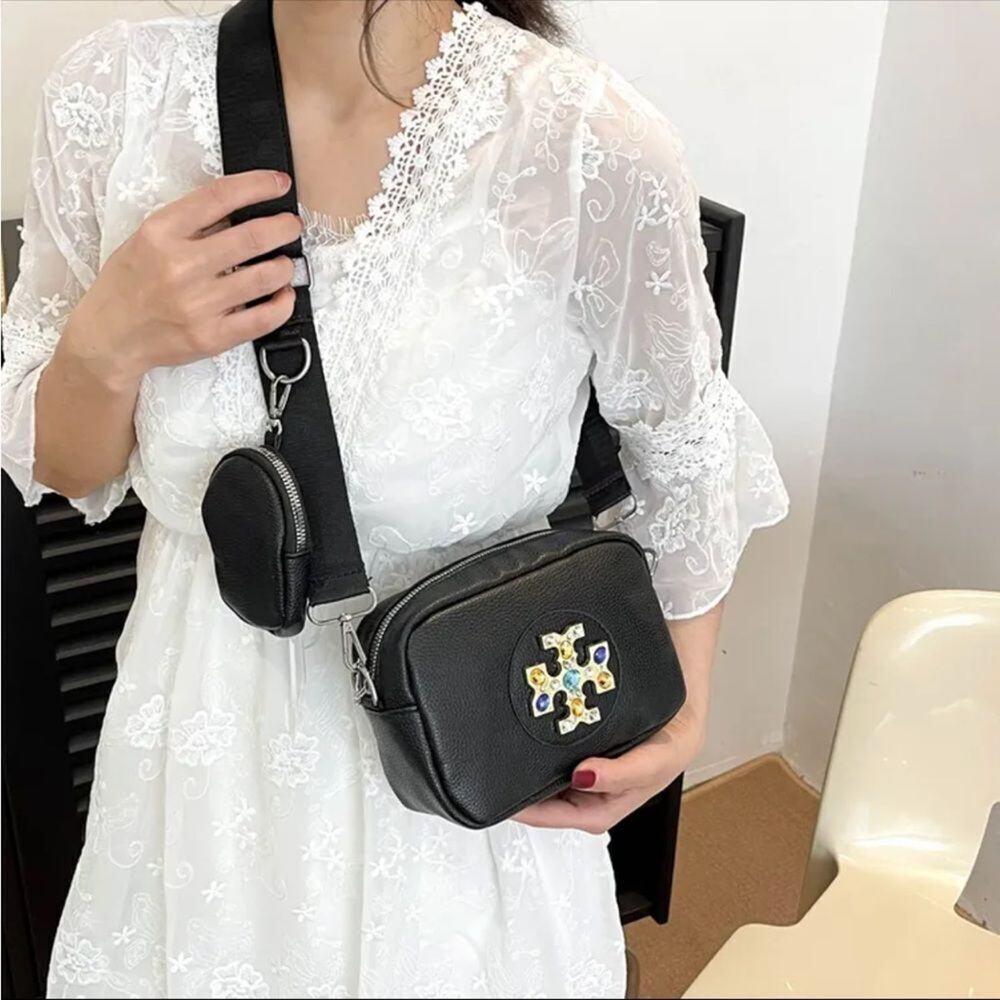 Black Crossbody Camera Bag with Decorative Emblem